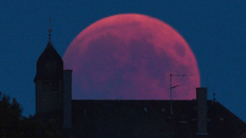 The Moon turns red during a total lunar eclipse in Bernkastel-Kues.
