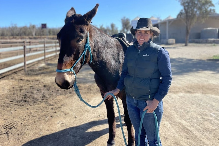 Photo of a woman with a mule.