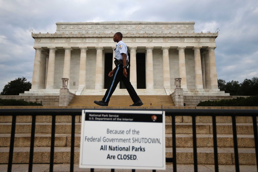 A policemen walks past a sealed-off Lincoln Memorial in Washington during the US government shutdown of October 2013.