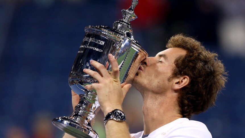 Andy Murray shows off the US Open trophy after defeating Novak Djokovic.