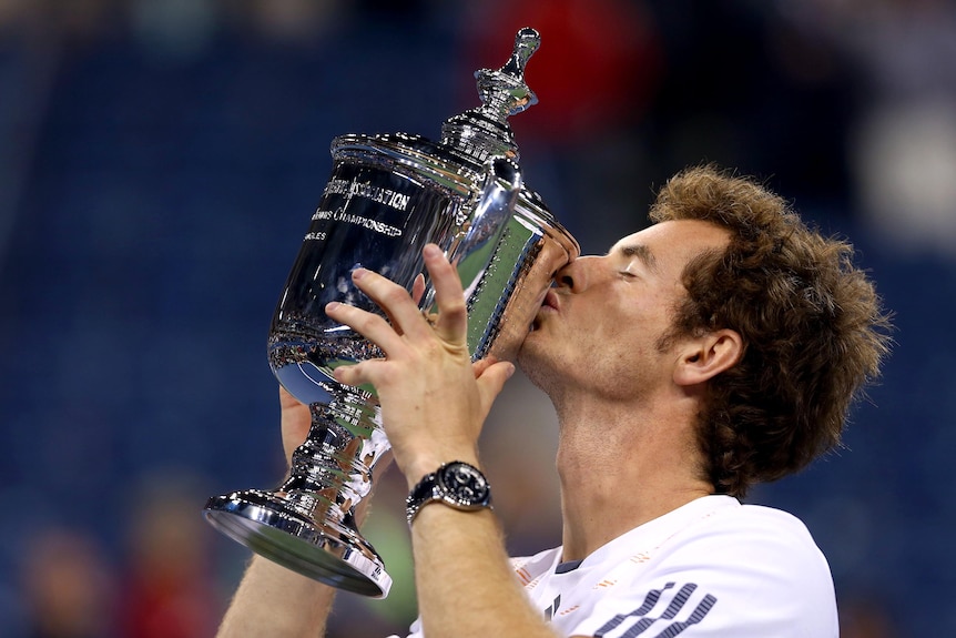 Andy Murray shows off the US Open trophy after defeating Novak Djokovic.