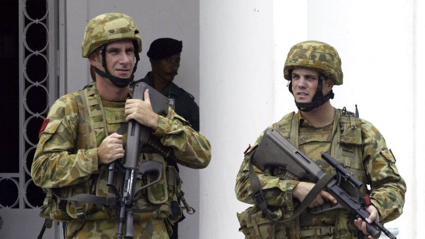 Australian soldiers stand guard in East Timor's capital Dili