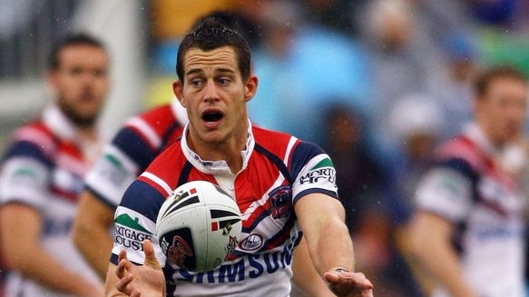 Ashley Harrison passes the ball for the Roosters