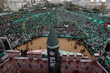 Palestinian Hamas supporters take part in a rally marking the 25th anniversary of the founding of Hamas.