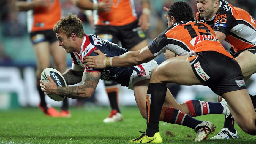 Jake Friend goes over for a try for the Roosters against Wests Tigers.