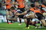 Jake Friend goes over for a try for the Roosters against Wests Tigers.