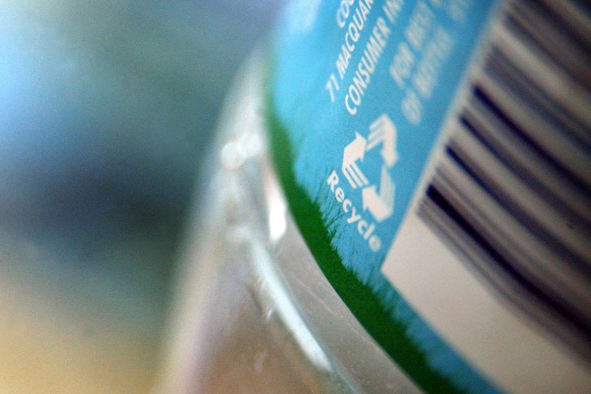 A recycling symbol on the side of a water bottle