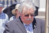 Former RSL NSW president Don Rowe lays a wreath.