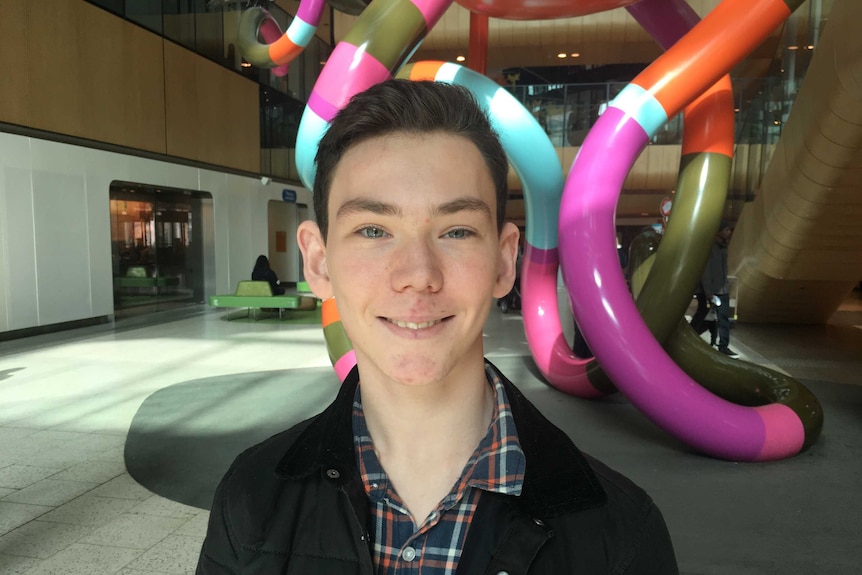 Louis Hehir in the foyer of the Royal Children's Hospital in Melbourne.