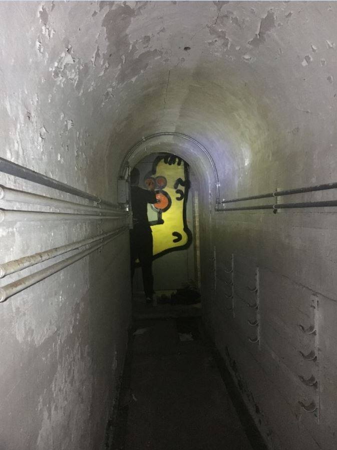 The anonymous Newcastle street artist H-Foot, leaving his Homer Simpson-like mark in a tunnel.