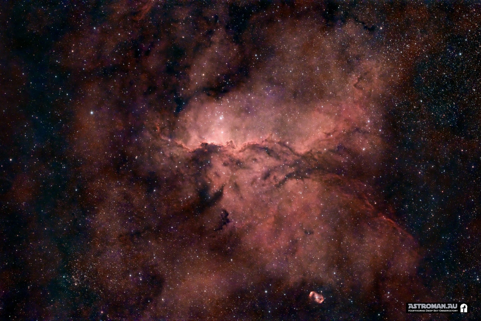 A red nebula and stars.