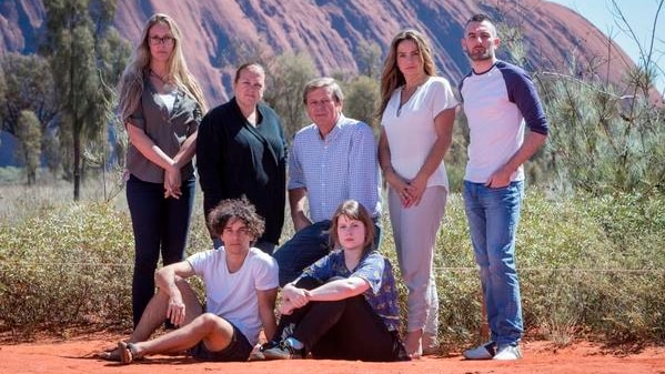 Host of SBS program First Contact, Ray Martin, with six of the participants.