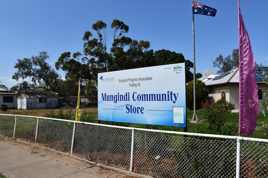A blue sign that reads 'Mungindi Community Store'.