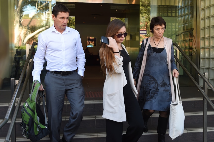 Jon, Bronwyn and Meryn O'Brien, the parents and sister of MH17 victim Jack O'Brien leaving court.