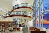 Artists impression of the Wrest Point refurbishment showing spiral stairs in the atrium with glass elevator.