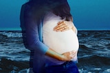 A pregnant woman standing in front of the ocean for a story about being pregnant when you have a mental illness like PTSD.