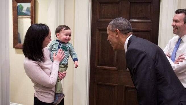 President Barack Obama greets White House Press Secretary Josh Earnest's son, Walker.