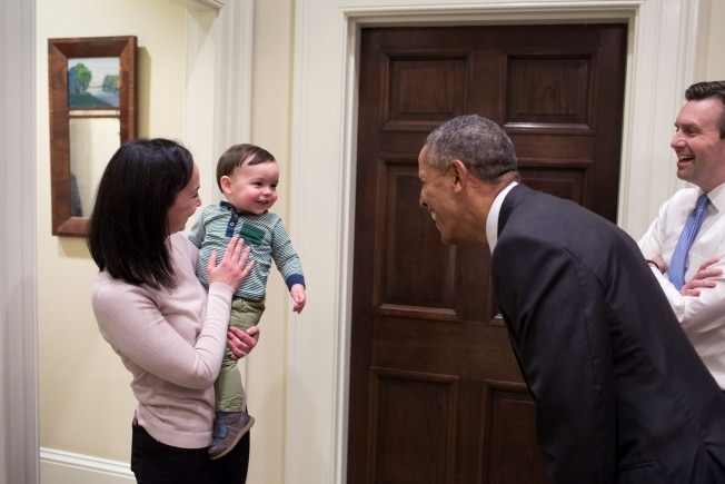 President Barack Obama greets White House Press Secretary Josh Earnest's son, Walker.