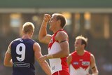 Downing the Dockers ... Sam Reid celebrates one of his three goals against Fremantle.