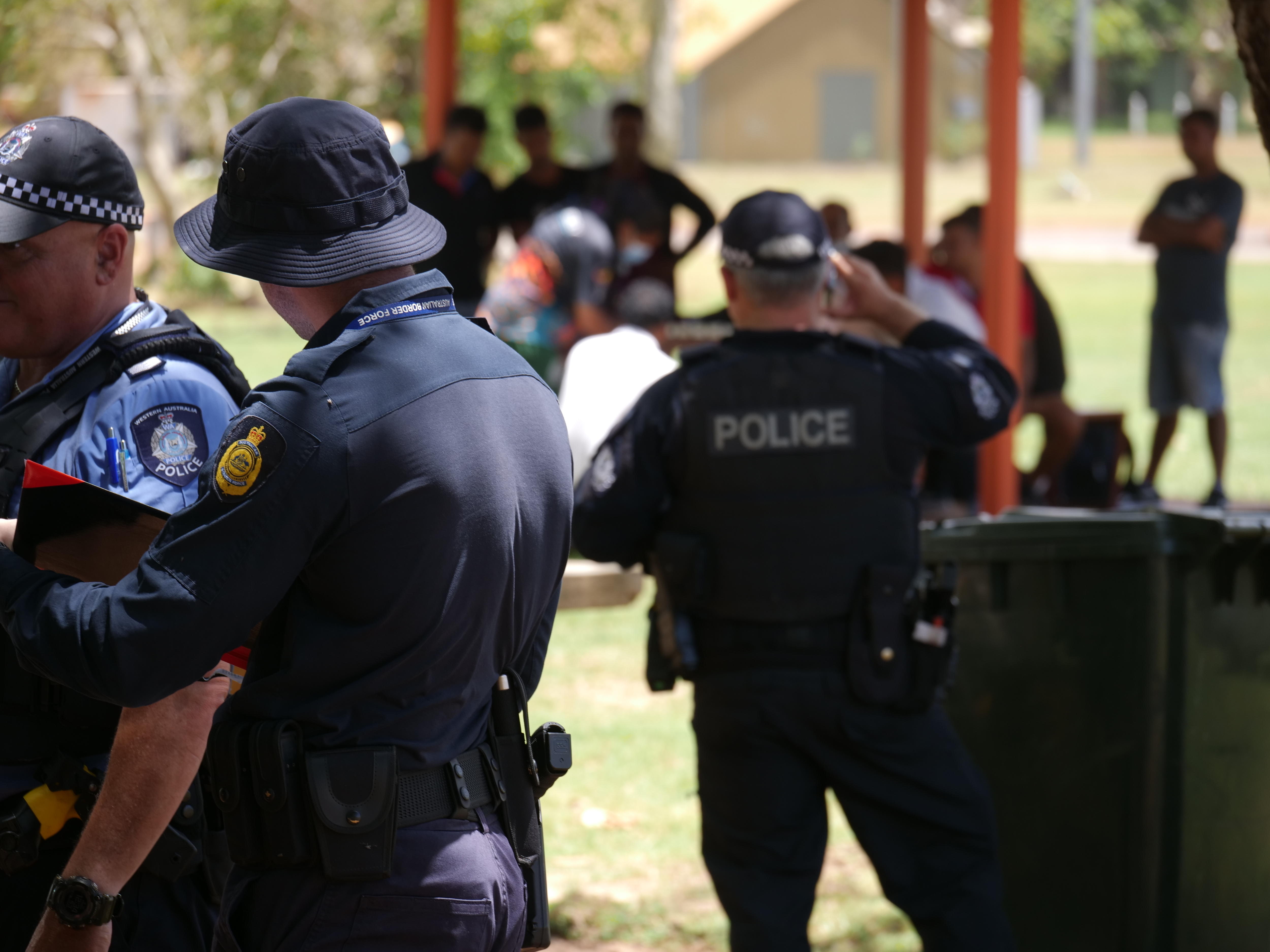A group of people stand together in uniforms.