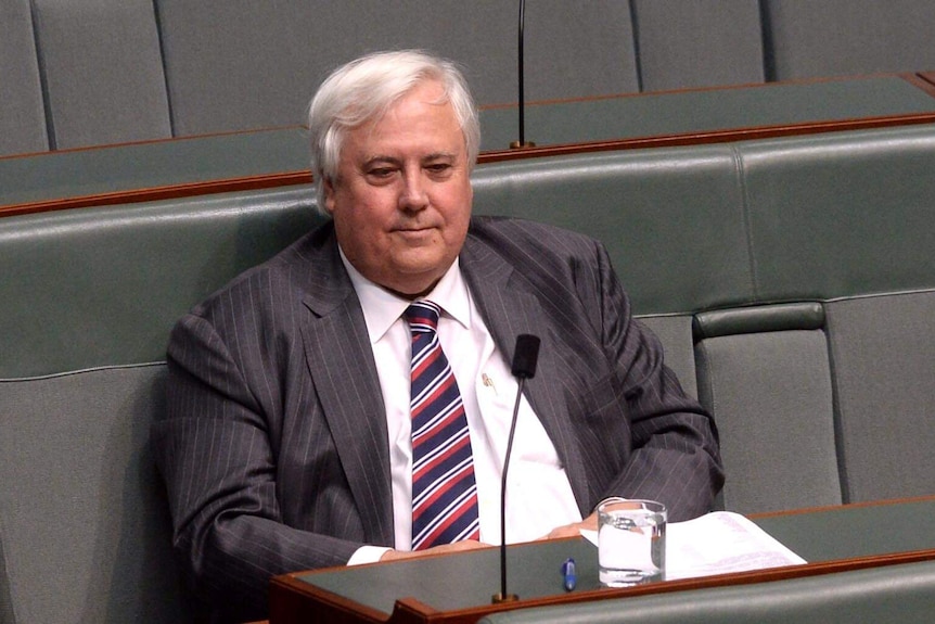 Clive Palmer listens during House of Representatives question time at Parliament House.