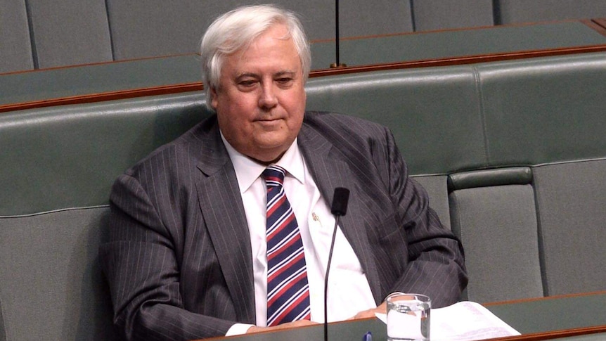 Clive Palmer listens during House of Representatives question time at Parliament House.