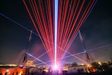 A laser light show over Hobart during Dark Mofo