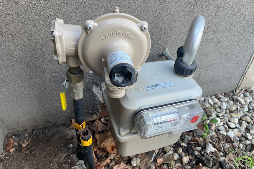 A close up shot of a gas meter outside a house
