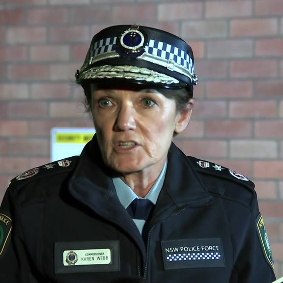 A police officer speaks at a media conference.
