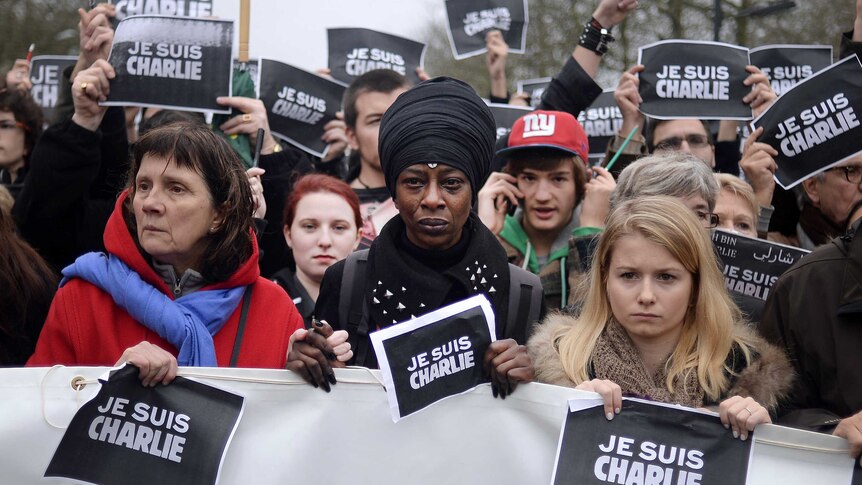 Three women in march in Nantes in memory of Charlie Hebdo victims