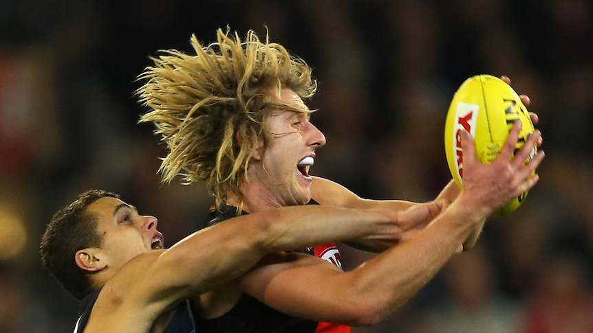 Heppell fights for possession in Blues win