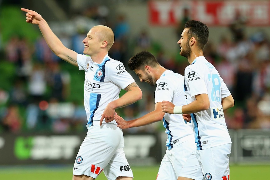 Aaron Mooy celebrates a goal against the Jets