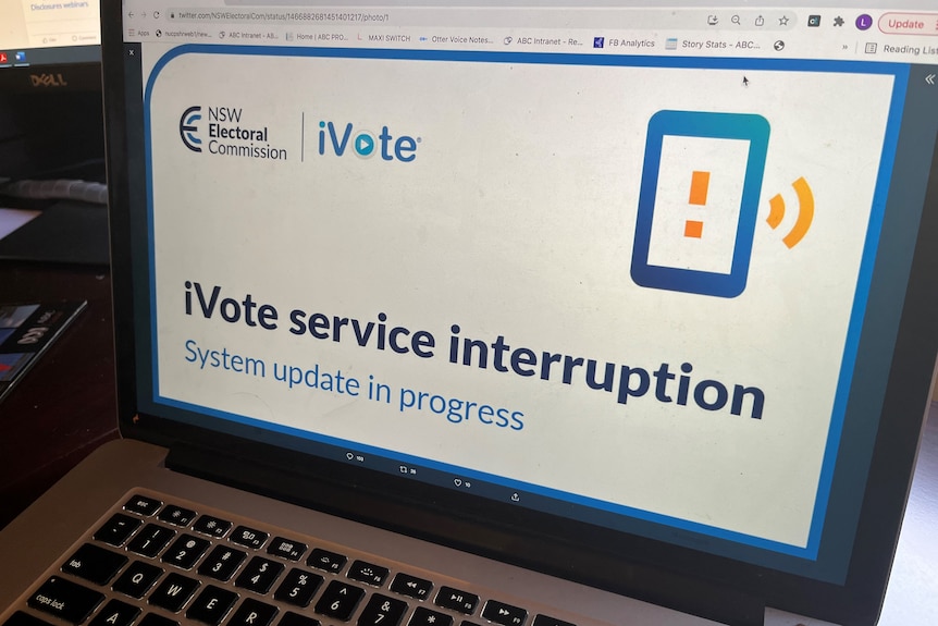 Social media image on a laptop reading 'ivote service interruption'