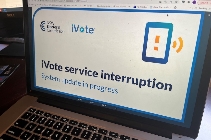 Social media image on a laptop reading 'ivote service interruption'