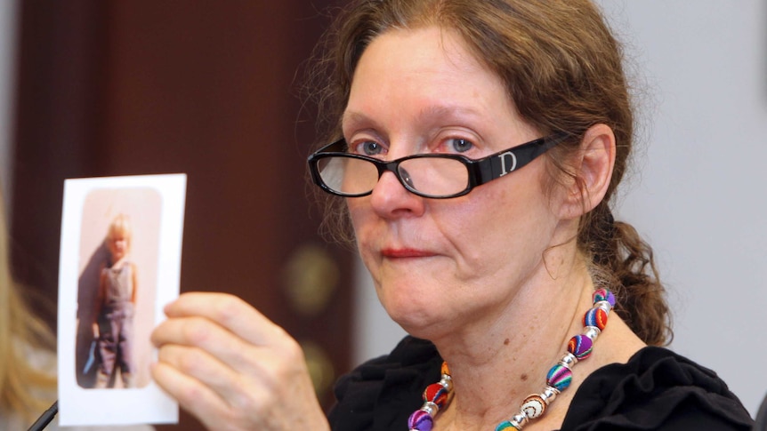 Christine Assange holds up a picture of her son when he was a child.