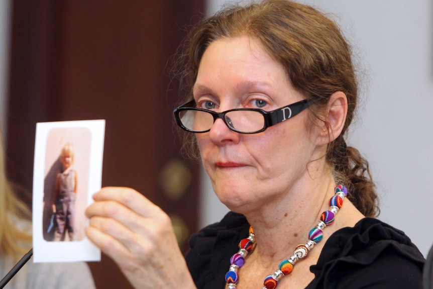 Christine Assange holds up a picture of her son when he was a child.