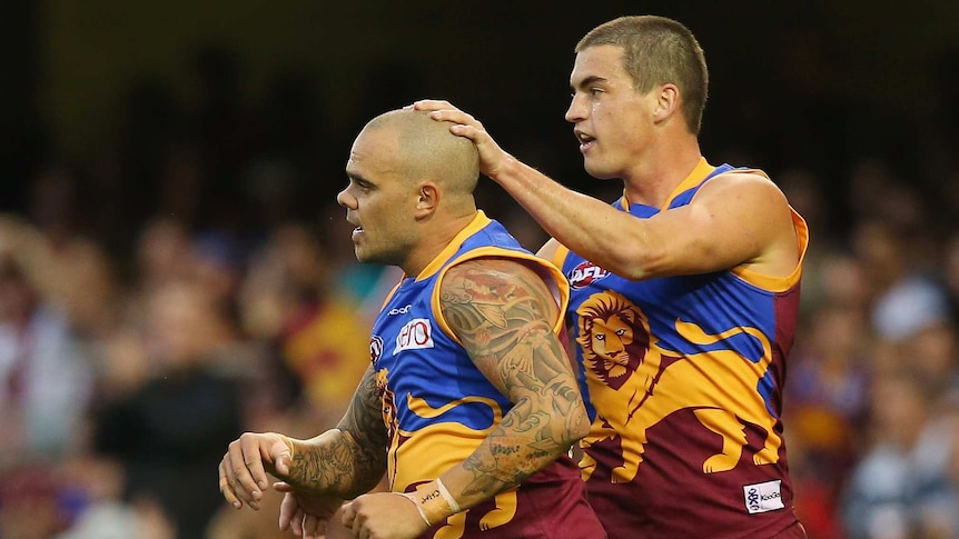 Rockliff gives McGrath a rub for good luck