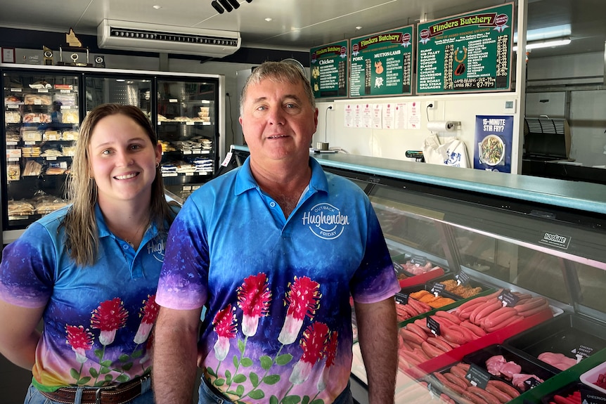 Woman and man stand next to eachother in a butcher shop