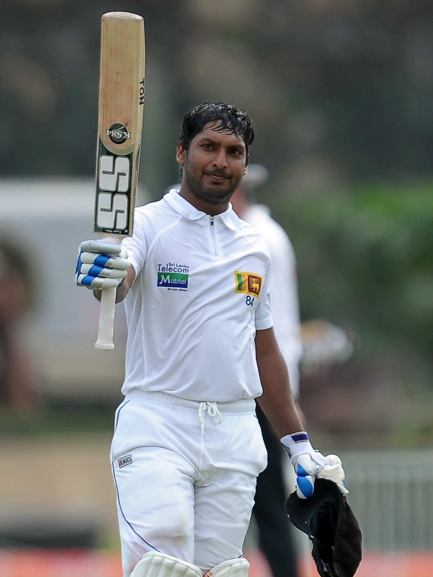 Sri Lanka's Kumar Sangakkara raises his bat after a Test century against Bangladesh in 2013.