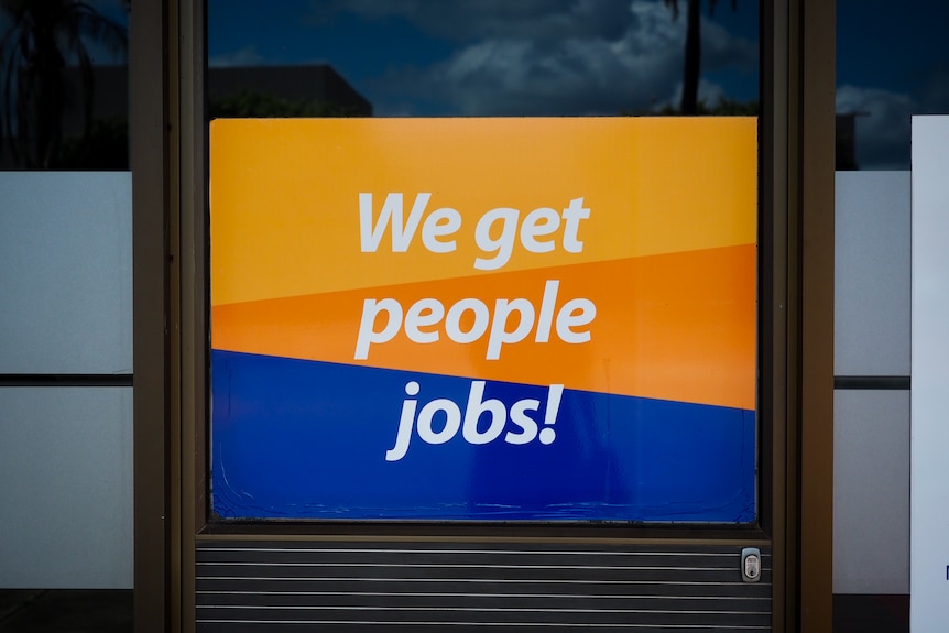 A sign saying "We get people jobs!" at a recruitment office in Griffith.