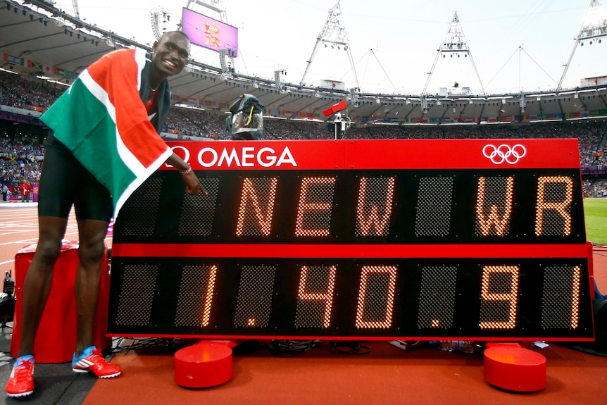 David Lekuta Rudisha points to the new world record he set after winning the men's 800m final.