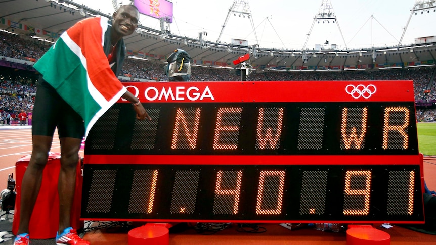 David Lekuta Rudisha points to the new world record he set after winning the men's 800m final.