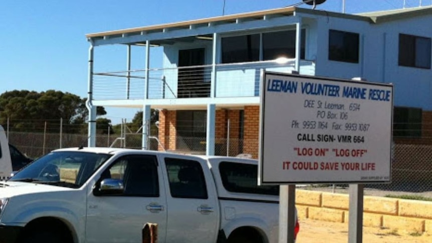 A white vehicle is parked near the leeman volunteer marine rescue office