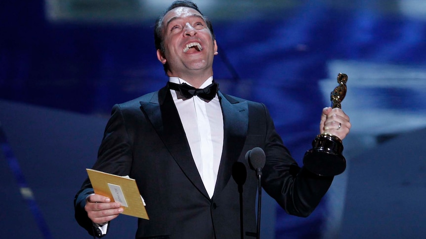 Jean Dujardin shouts in excitement after winning the best actor Oscar