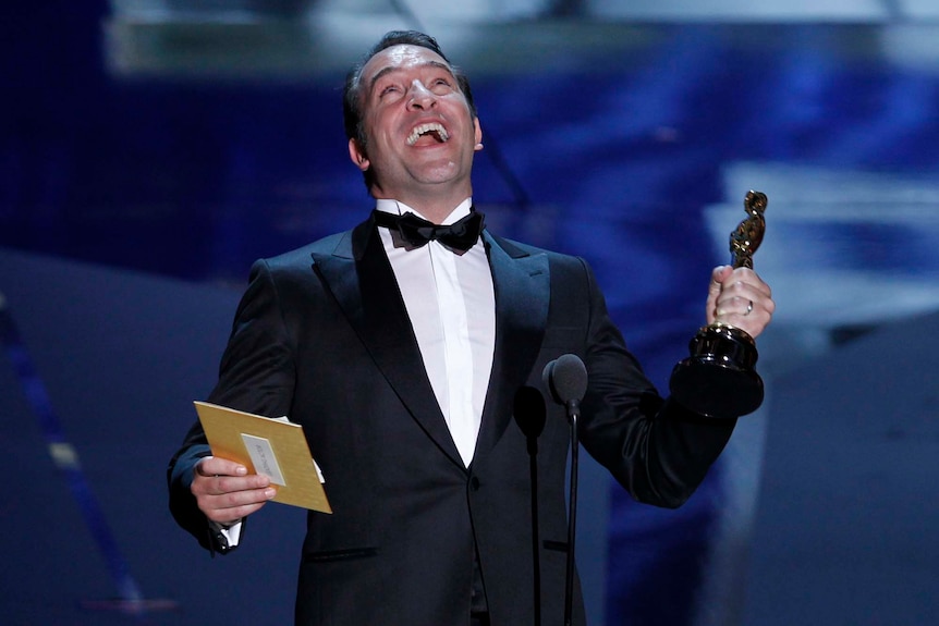 Jean Dujardin shouts in excitement after winning the best actor Oscar