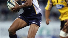 George Gregan makes a run for the Brumbies