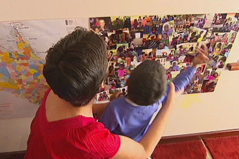 Jude Fariss watches as an Aboriginal child points at a map in Perth