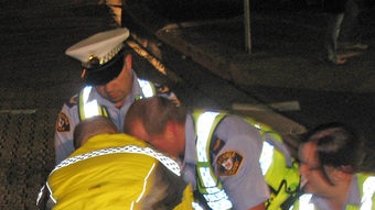 Tasmanian police arrest a drunk hotel patron in Hobart's waterfront.