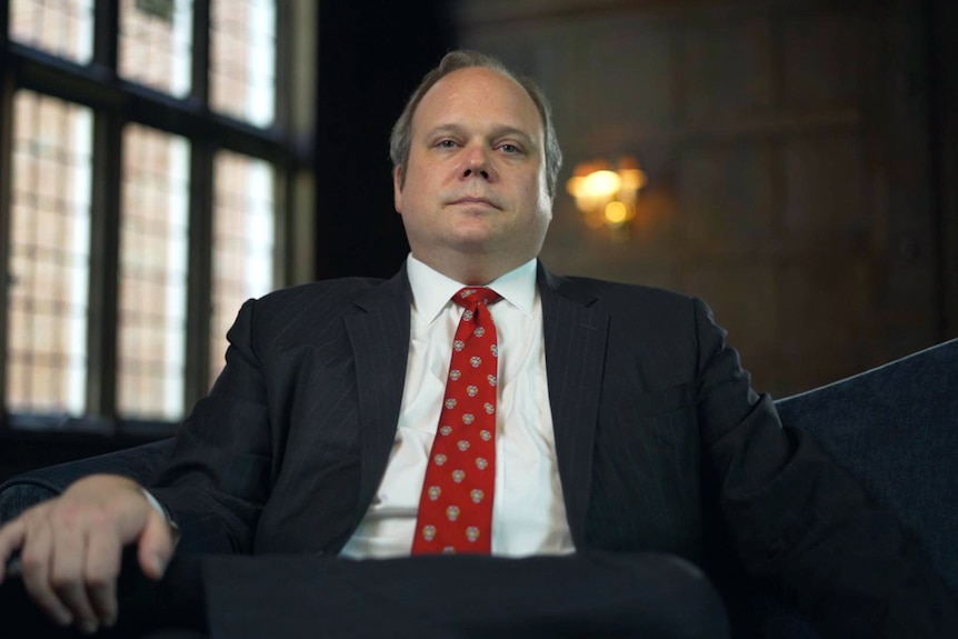 Chris Stirewalt sits in an armchair looking down the barrel.