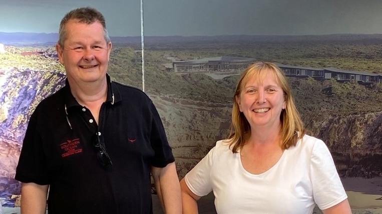 John and Alison standing next to each other smiling